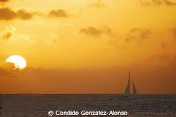 Back from Bonaire sunsets and sailboats lost in the horrizon by Candido Gonzalez-Alonso 
